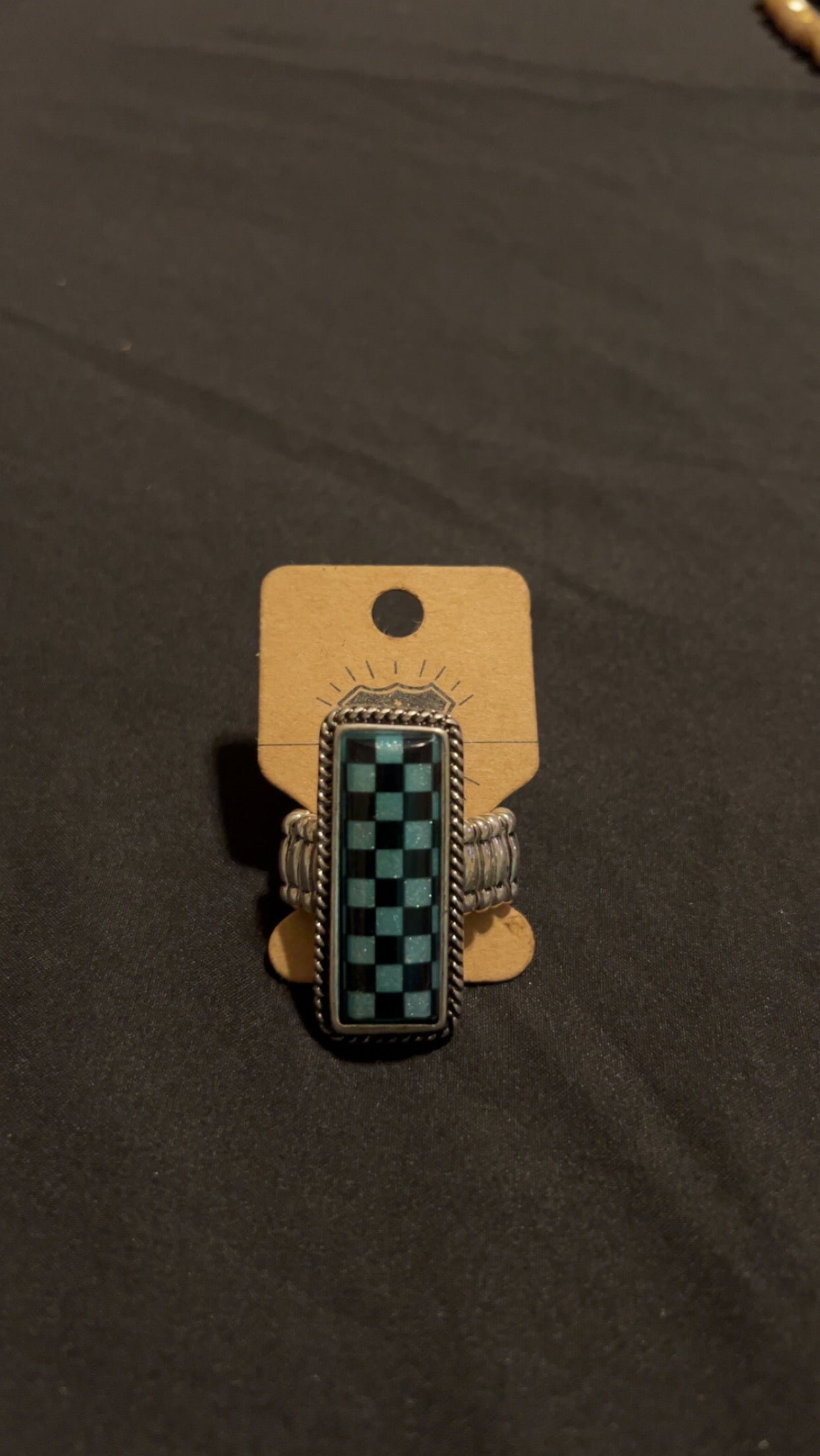 Adjustable checkered ring