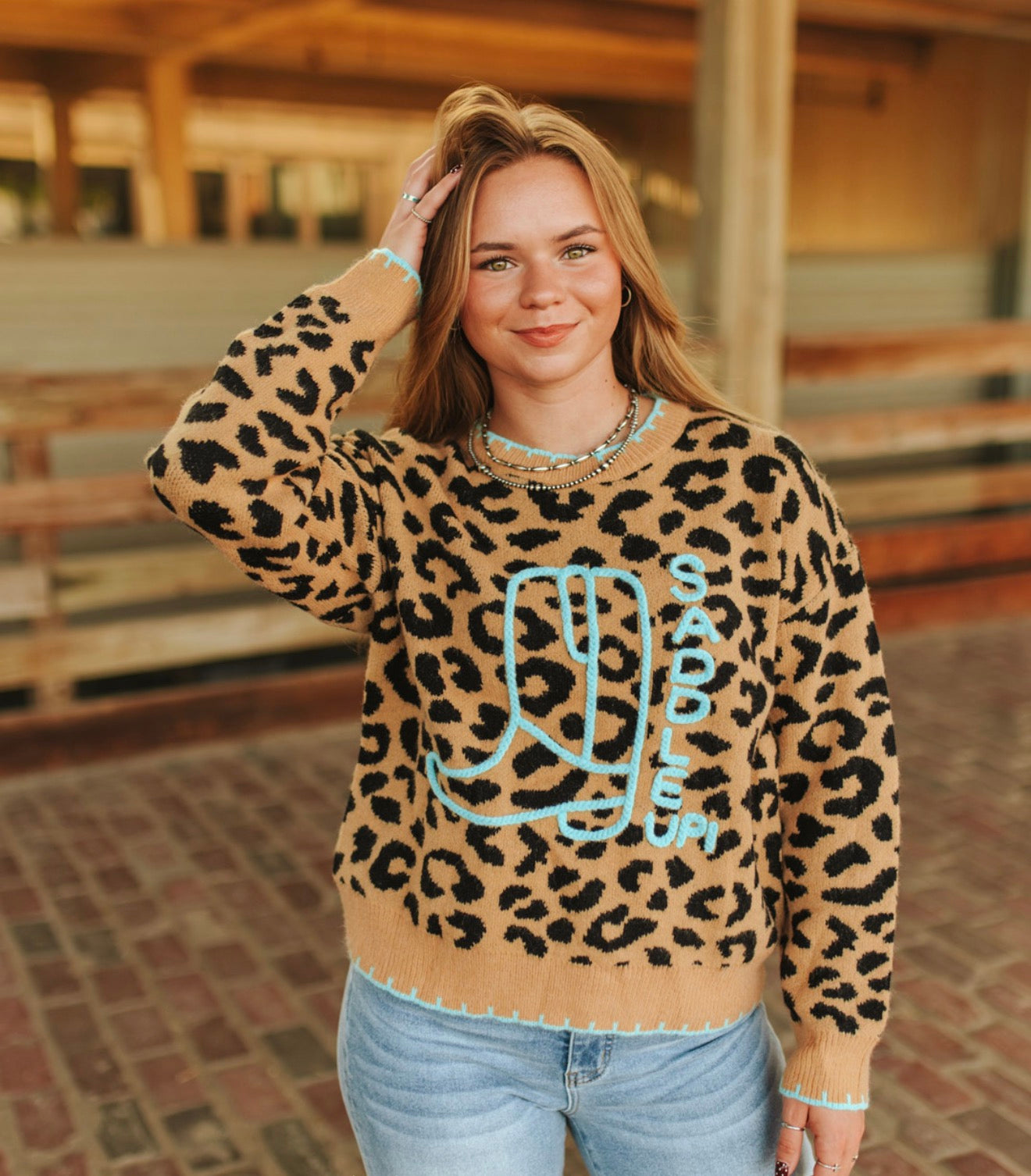 Soft leopard knit with contrast saddle stitch